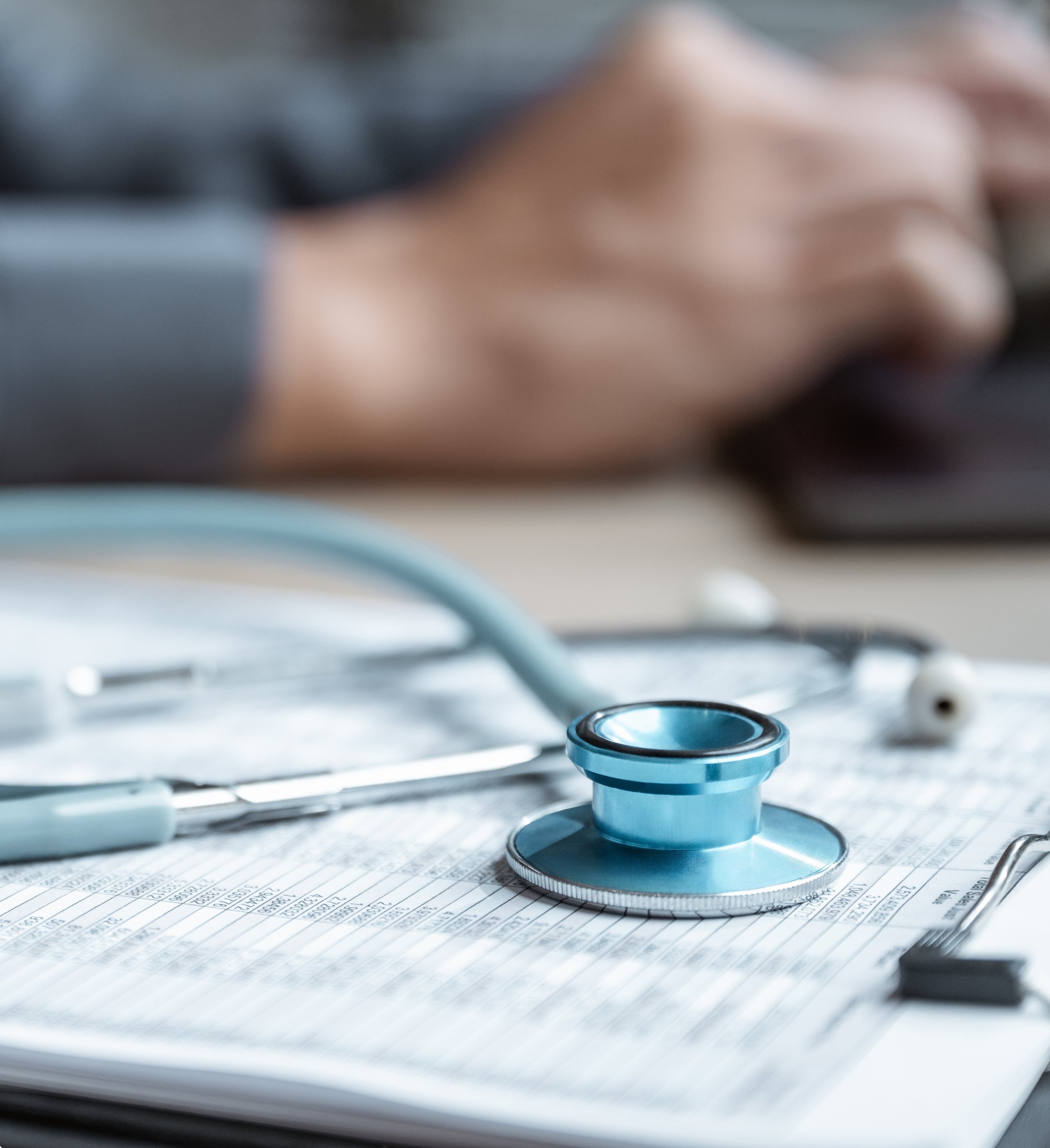 2019 milestone: healthcare platform investments, stethoscope resting on patient medical records
