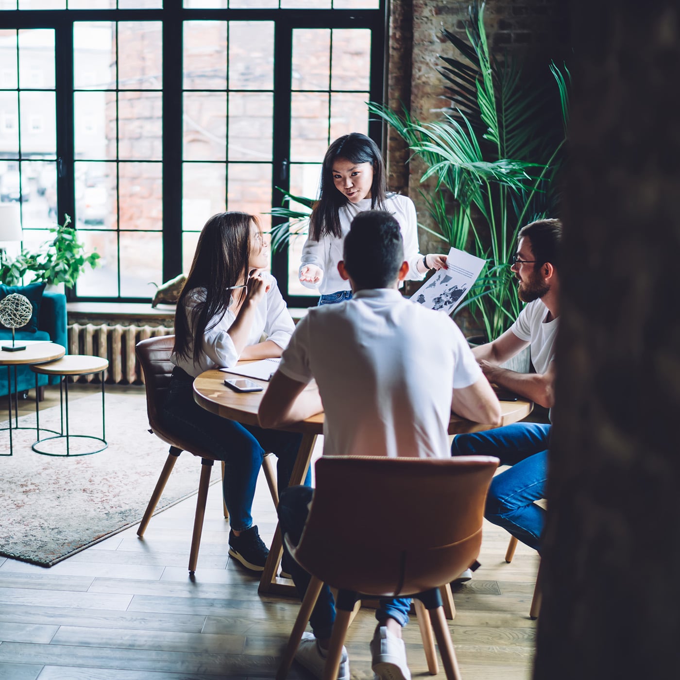 Team of professionals collaborating around a table in a modern office