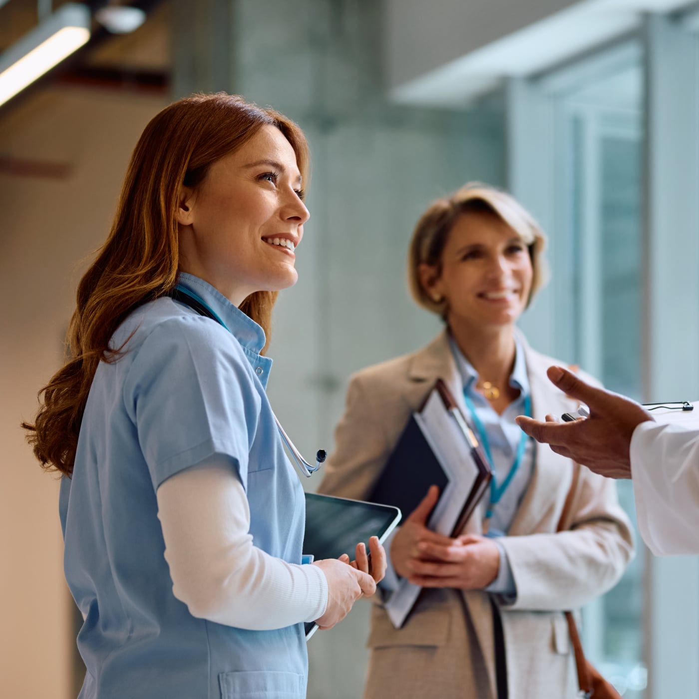 Healthcare professionals discussing patient care in a clinical setting