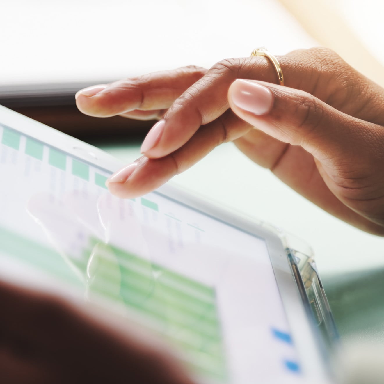 Person reviewing ESG data on a tablet